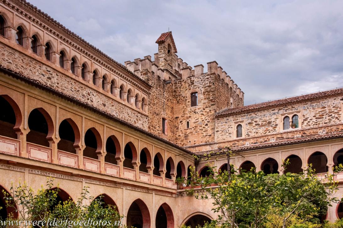Royal Monastery of Santa María de Guadalupe - The courtyard and Mudéjar cloister of the Royal Monastery of Santa María de Guadalupe. This extraordinary monastery was built on the... Royal Monastery of Santa María de Guadalupe - The courtyard and Mudéjar cloister of the Royal Monastery of Santa María de Guadalupe. This extraordinary monastery was built on the...