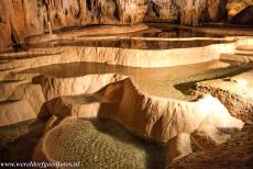 Caves of the Slovak Karst - Domica Cave - The caves of Aggtelek Karst and Slovak Karst: The cascade dripstone lakes in the Domica Cave. The green colour of the water is caused by...