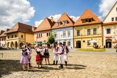 Bardejov Town - Bardejov Town Conservation Reserve: Several people dressed in Slovak national costume during the 'jarmok' of Bardejov, in the background...