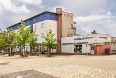 Berlin Modernism Housing Estates - Berlin Modernism Housing Estates: The shops and a restaurant in the Hufeisensiedlung. One of the shops houses the Modernism Housing...