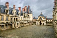 Palace and Park of Fontainebleau - The Palace and Park of Fontainebleau: The Cour Ovale, the Oval Courtyard, and the entrance on the east side, the Baptistery Gate. The Oval...