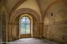 Cistercian Abbey of Fontenay - Cistercian Abbey of Fontenay: The Chapter Room was used for meetings. A gentle glow of light shines through the stained glass windows of the...