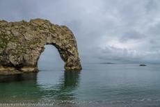 Dorset and East Devon Coast - The Dorset and East Devon Coast: The iconic natural rock arch of Durdle Door at high tide on a misty morning. The Dorset and East Devon Coast also... Dorset and East Devon Coast - The Dorset and East Devon Coast: The iconic natural rock arch of Durdle Door at high tide on a misty morning. The Dorset and East Devon Coast also...