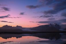 Vatnajökull National Park - Vatnajökull National Park - Dynamic Nature of Fire and Ice: The breathtaking pink twilight sky is reflected in the still,... Vatnajökull National Park - Vatnajökull National Park - Dynamic Nature of Fire and Ice: The breathtaking pink twilight sky is reflected in the still,...