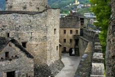 The three Castles of Bellinzona - The courtyard of Montebello Castle viewed from the castle wall walk. The castle was expanded in the 15th century, the inner keep dates...