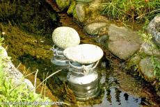 Wooden Churches of Southern Małopolska - The priest is the tour guide of the Church of the Archangel Michael in Dębno, he keeps his milk as cool as possible in the small stream...