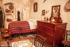 Sassi di Matera and Churches of Matera - The Sassi and the Park of the Rupestrian Churches of Matera: The bedroom in a cave dwelling. The furniture of a cave house...