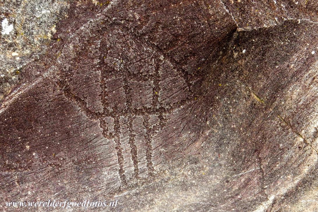 Rock Drawings in Valcamonica - Rock Drawings in Valcamonica: A rock drawing of a hut-like figure, the representation of huts are particular frequent in the City Archaeological...
