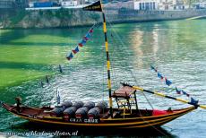 Historic Centre of Porto - A traditional Rabelo boat on the Douro, the River of Gold, in the historic centre of Porto. The wooden Rabelo boats were used to transport...